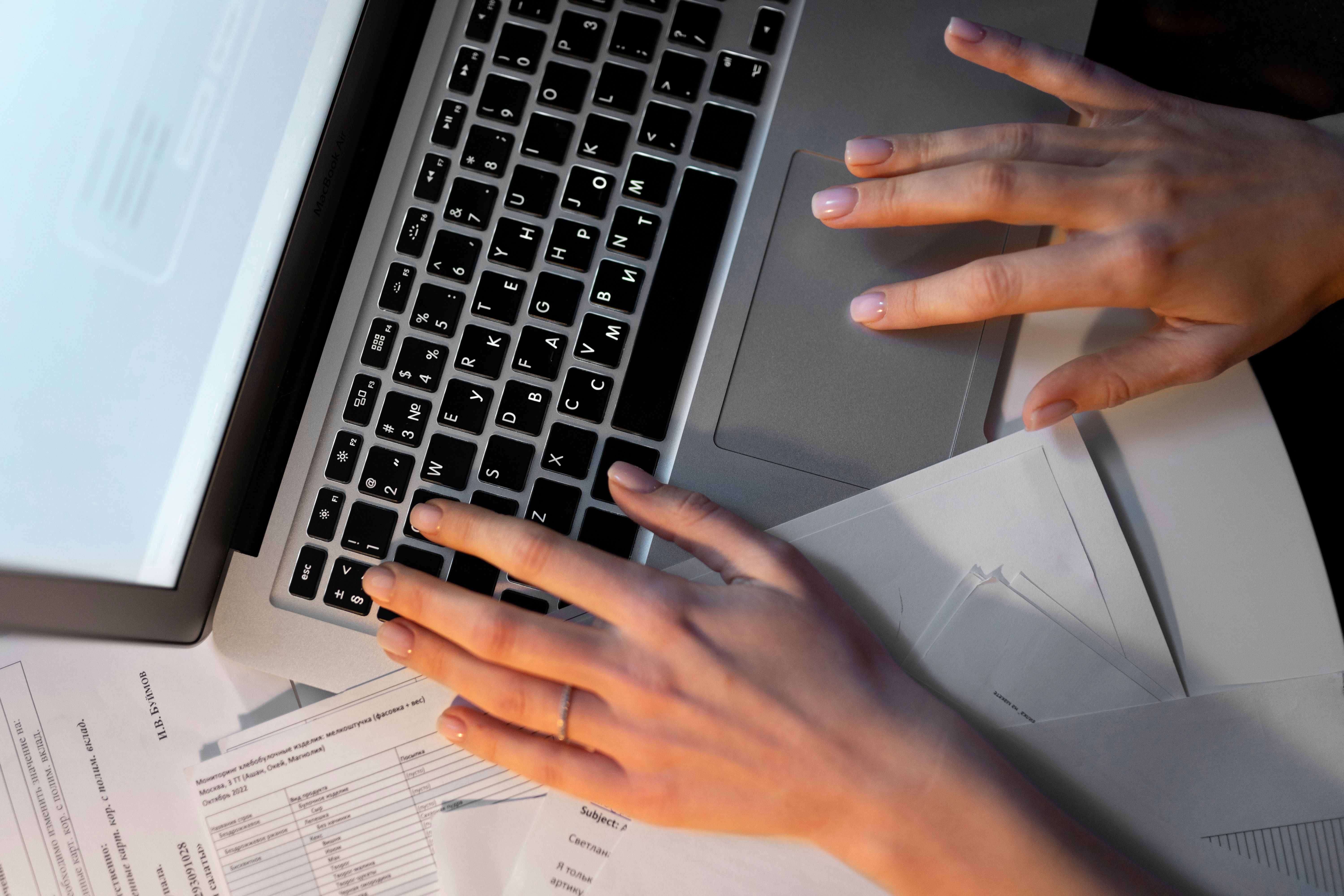 top-view-hands-typing-keyboard